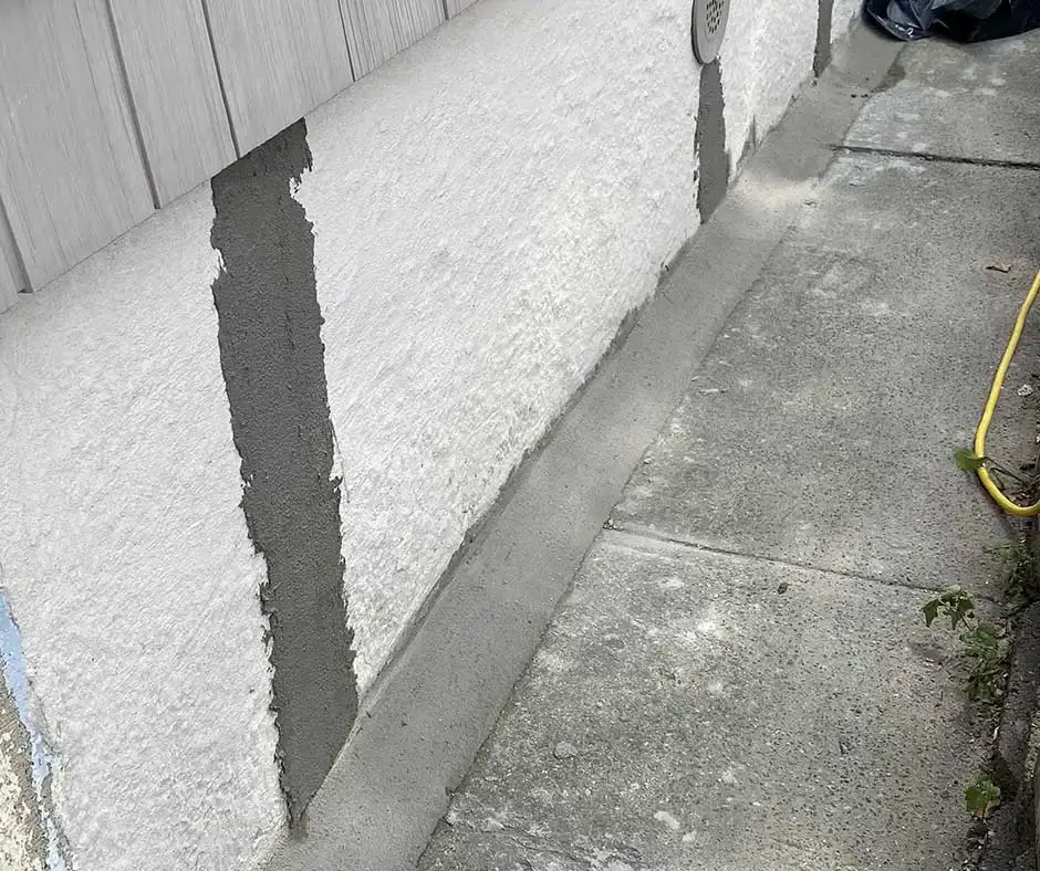 Close-up of exterior foundation wall Basement Crack Repair Rochester, NY