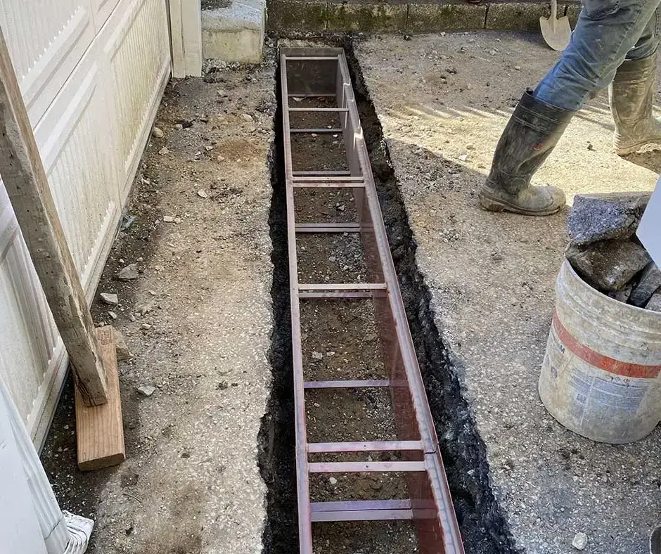 Dug trench French Drain Installation Rochester, NY