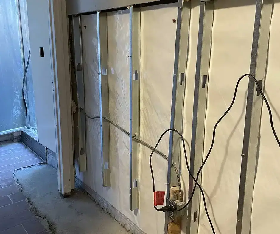 Interior wall with exposed Basement Crack Repair Rochester, NY