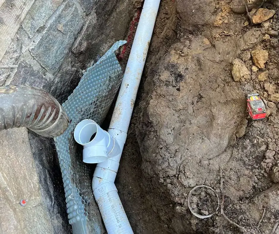 PVC drainage pipe French Drain Installation Rochester, NY