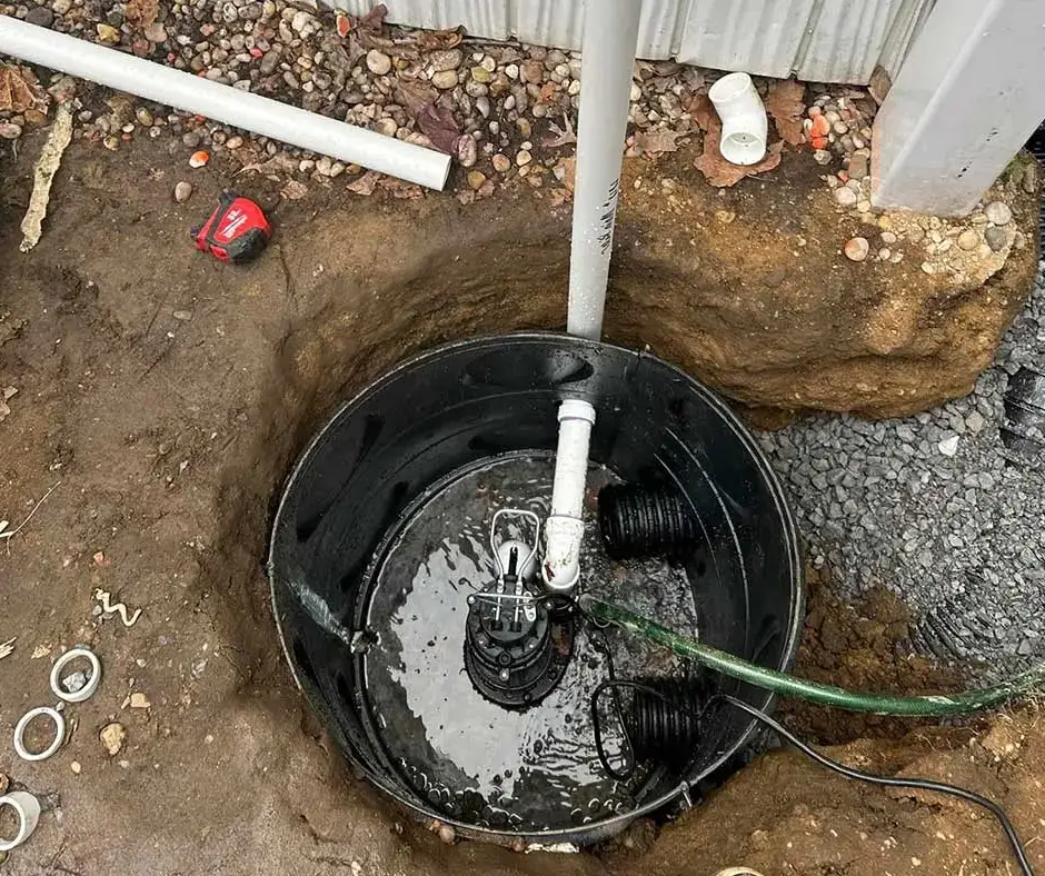 White drainage pipes connected Sump Pump Installation Rochester, NY White drainage pipes connected Sump Pump Installation Rochester, NY